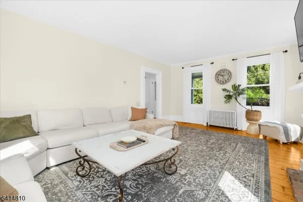 a living room with furniture and window