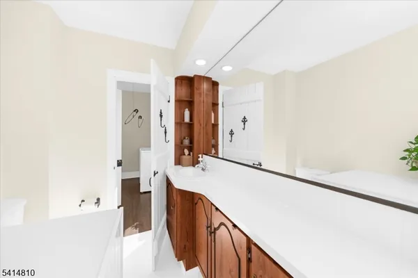 a bathroom with a bathtub and a sink