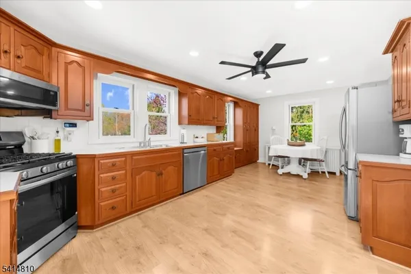 a kitchen with a stove a sink and a refrigerator