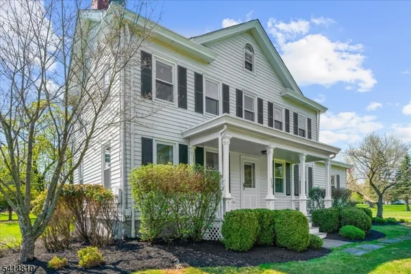 a view of a house with a yard and plants