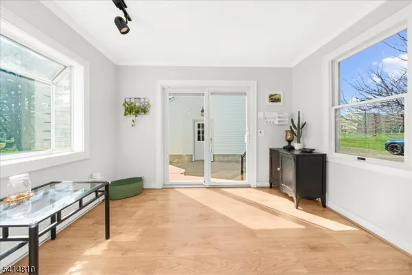 a spacious bedroom with a bed and a window