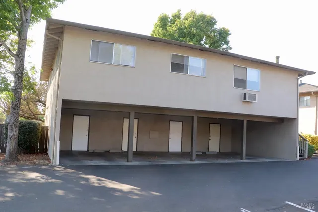 a front view of a house with garage