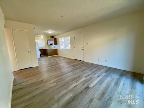 a view of a kitchen with a sink and a window