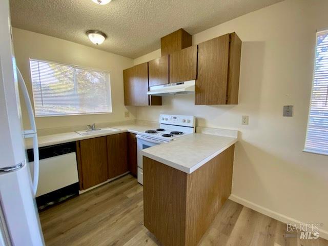 950 Santa Alicia Drive Rohnert Park, CA 94928 - Photo 5 of 17 a kitchen with a sink cabinets and wooden floor