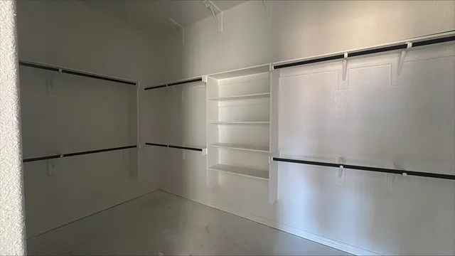 a view of a building with car parked