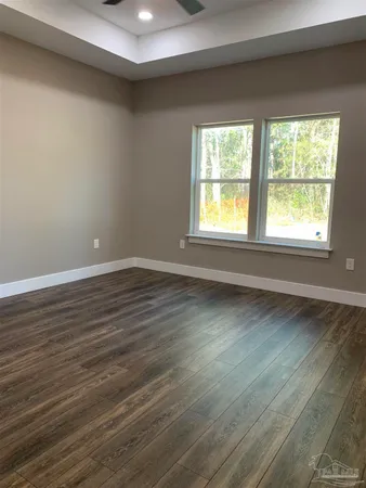 a bathroom with a granite countertop sink double and mirror