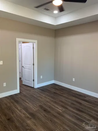 a bathroom with a glass door shower and vanity