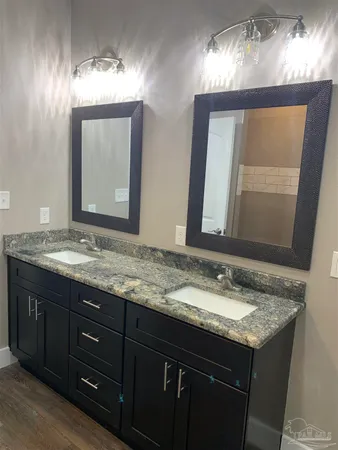 a white toilet sitting next to a white wall