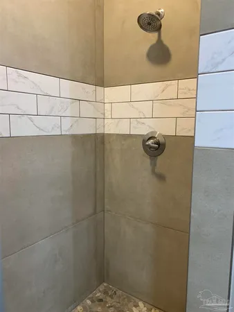 a bathroom with a bathtub and a toilet