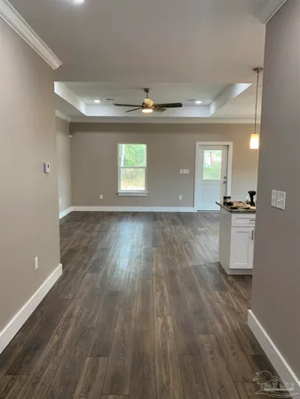 a view of room with wooden floor