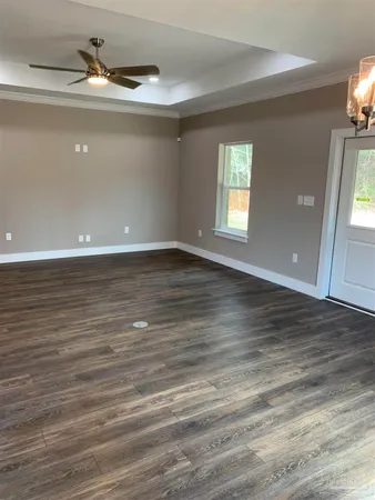 a view of kitchen with refrigerator stove and cabinets