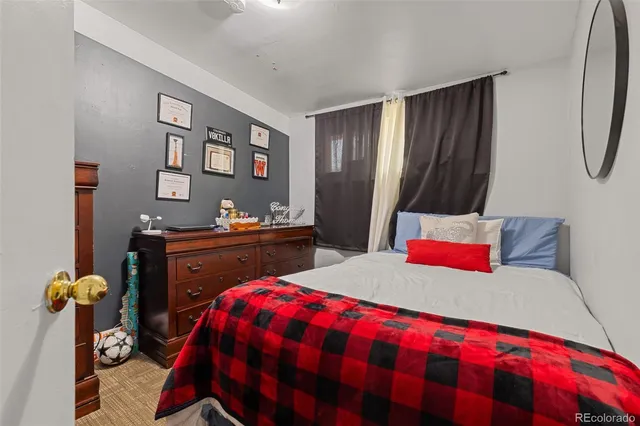 a living room with furniture a rug and a chandelier