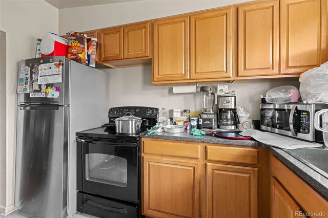 a kitchen with sink cabinets and appliances