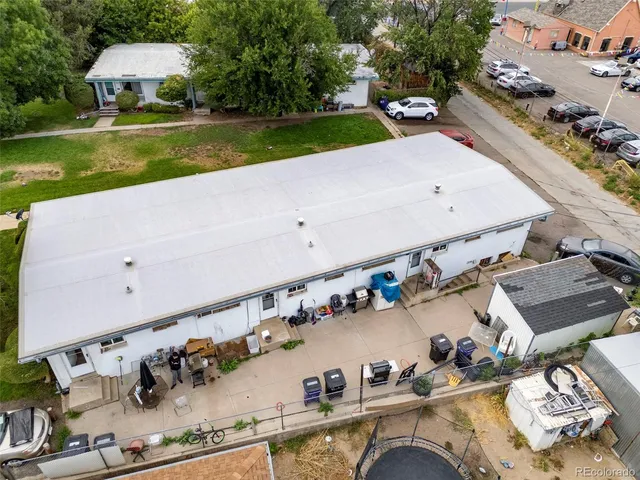an aerial view of a house with yard swimming pool and outdoor seating