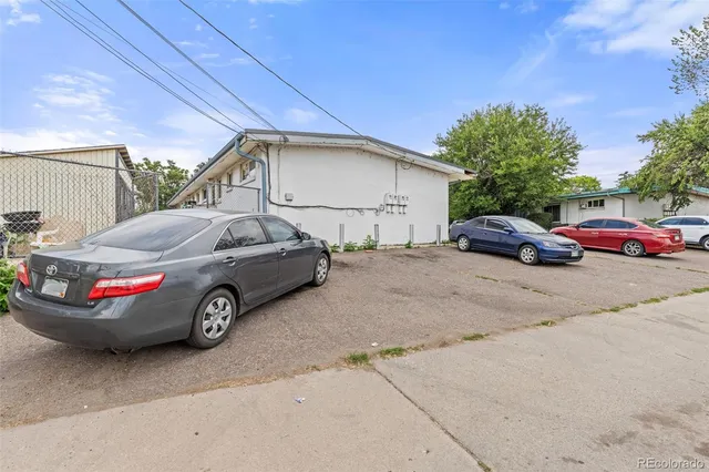 a view of a car parked in front of a house