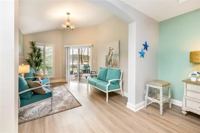 an aerial view of residential houses with outdoor space and river