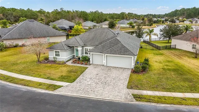 an aerial view of a swimming pool patio swimming pool and outdoor seating