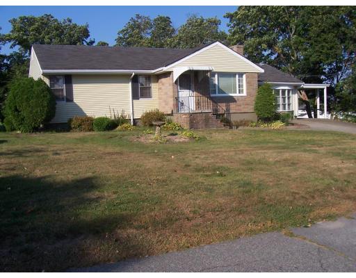 74 Kaufman Road Somerset, MA 02726 - Photo 2 of 12 a front view of a house with a yard