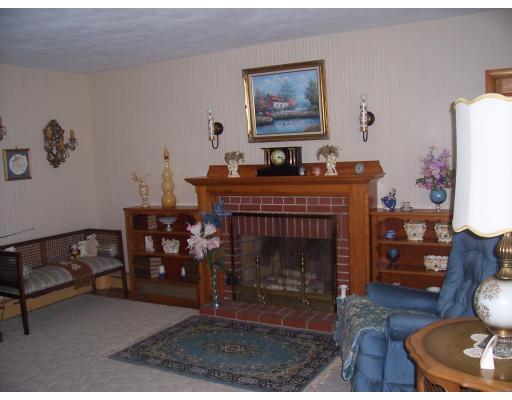 74 Kaufman Road Somerset, MA 02726 - Photo 4 of 12 a living room with furniture and a fireplace