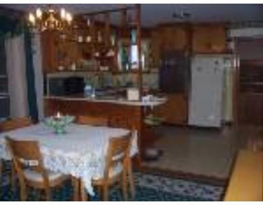 74 Kaufman Road Somerset, MA 02726 - Photo 7 of 12 a room with water heater and wooden floor