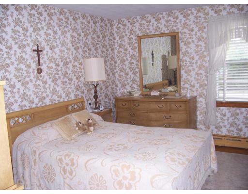 74 Kaufman Road Somerset, MA 02726 - Photo 9 of 12 a bedroom with a bed and a night stand