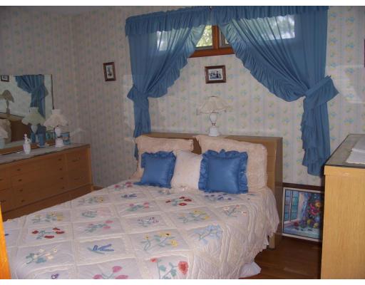 74 Kaufman Road Somerset, MA 02726 - Photo 10 of 12 a bed sitting in a bedroom and mirror