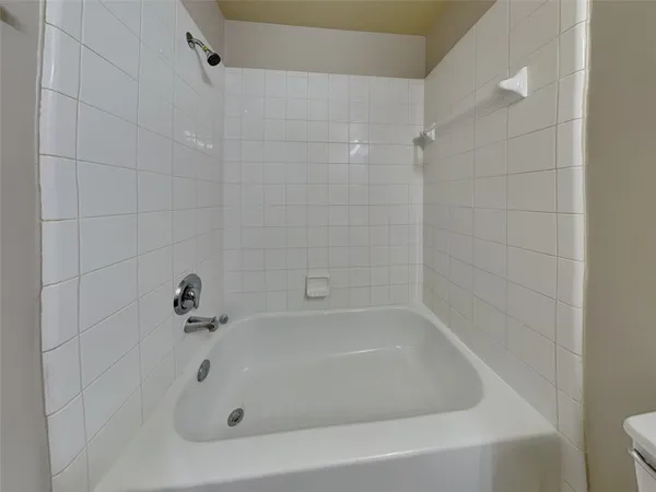a en suite bathroom with a sink and a mirror
