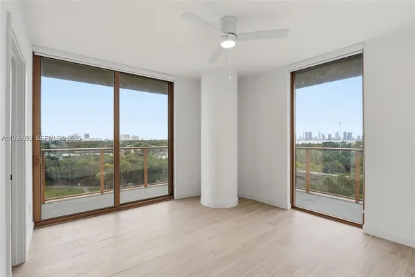 a view of an empty room with glass door