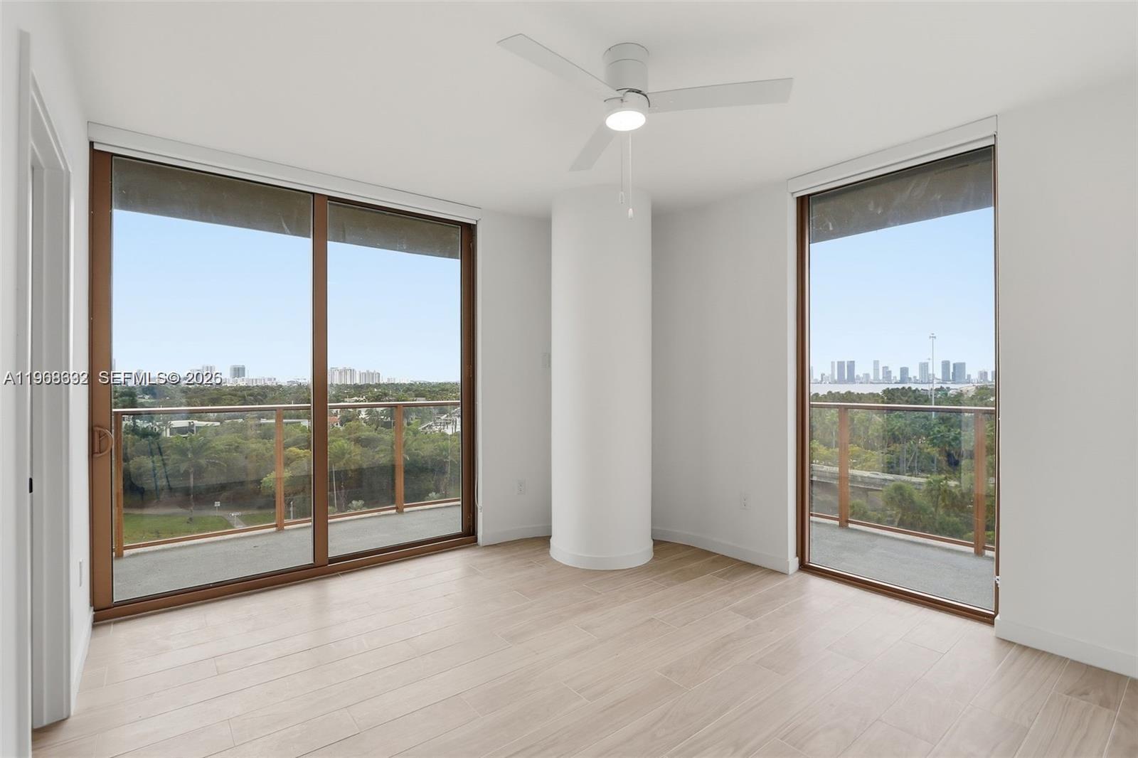 3900 Alton Road, Unit 208 Miami Beach, FL 33140 - Photo 13 of 26 a view of an empty room with glass door