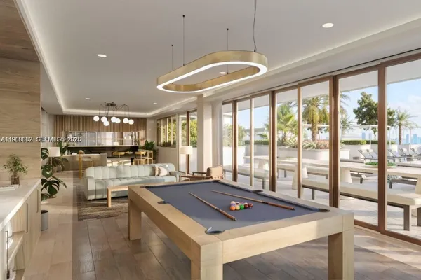 a room with lots of table and a large window