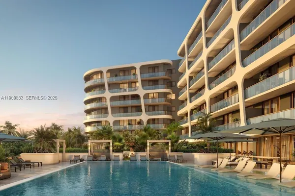 a front view of a building with swimming pool