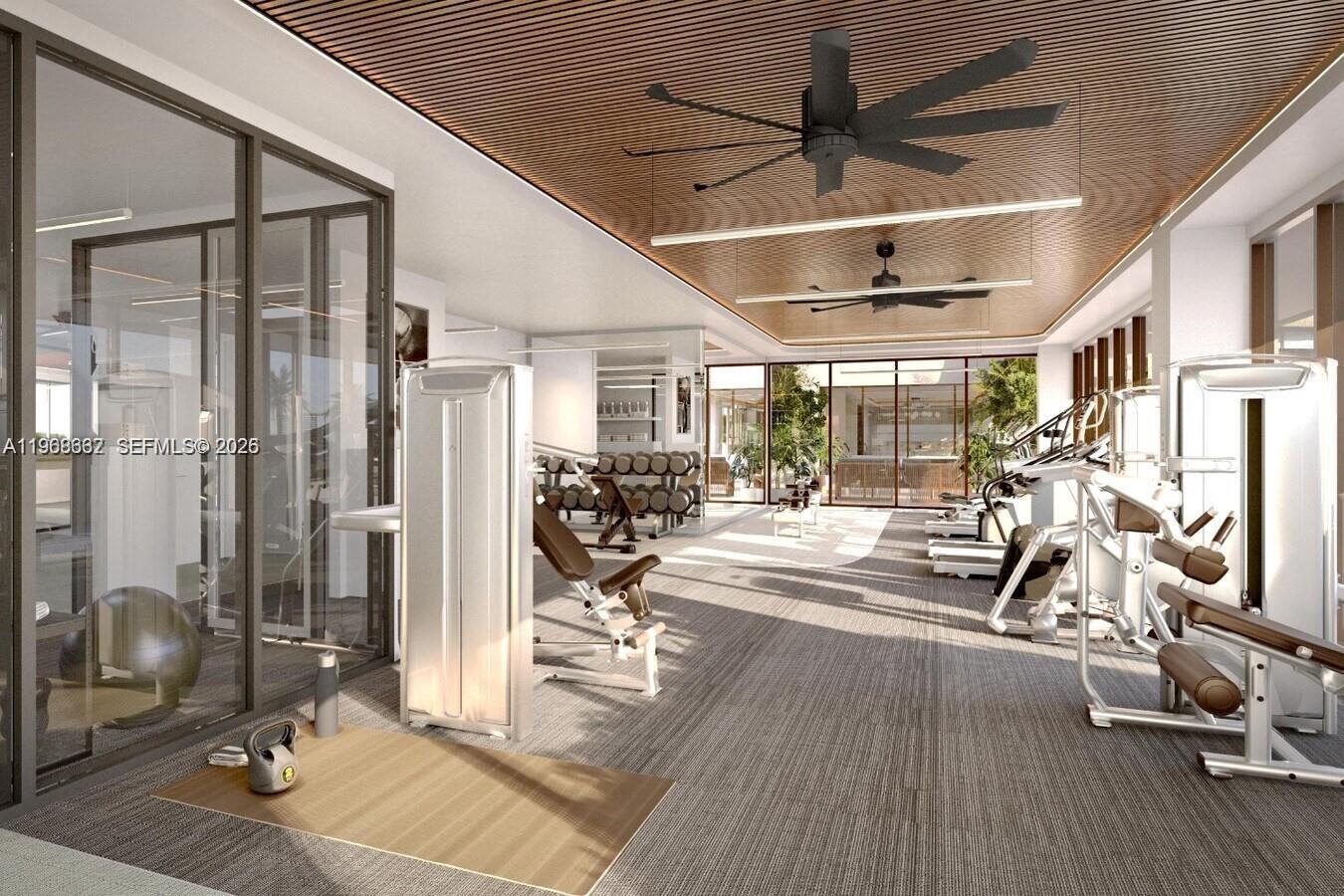3900 Alton Road, Unit 208 Miami Beach, FL 33140 - Photo 5 of 26 a view of a room with gym equipment