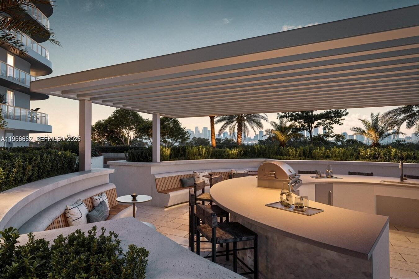 3900 Alton Road, Unit 208 Miami Beach, FL 33140 - Photo 6 of 26 a roof deck with table and chairs and potted plants