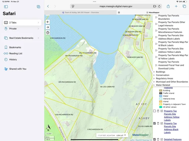 a picture of a white wall with a vase of flowers on it