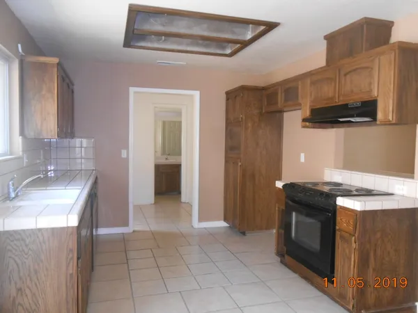 a kitchen with a stove and a sink