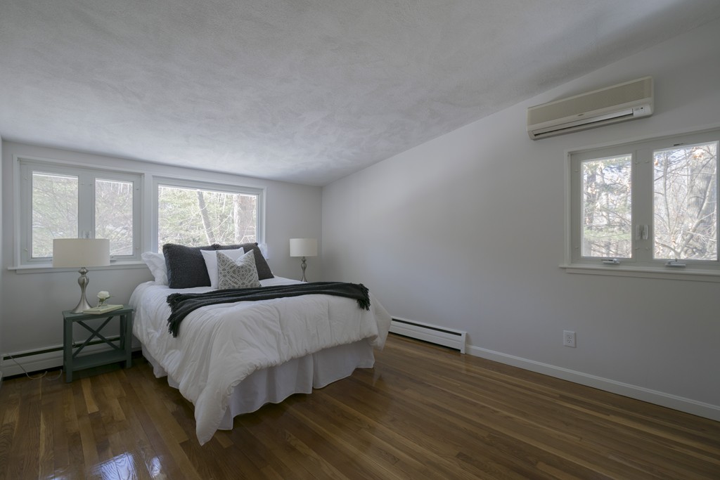 18 Peacock Farm Road Lexington, MA 02421 - Photo 19 of 30 a bedroom with a bed and window