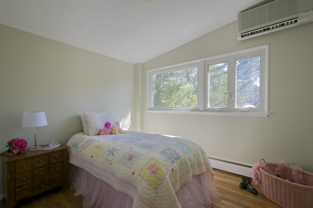 18 Peacock Farm Road Lexington, MA 02421 - Photo 23 of 30 a bedroom with a bed and a window