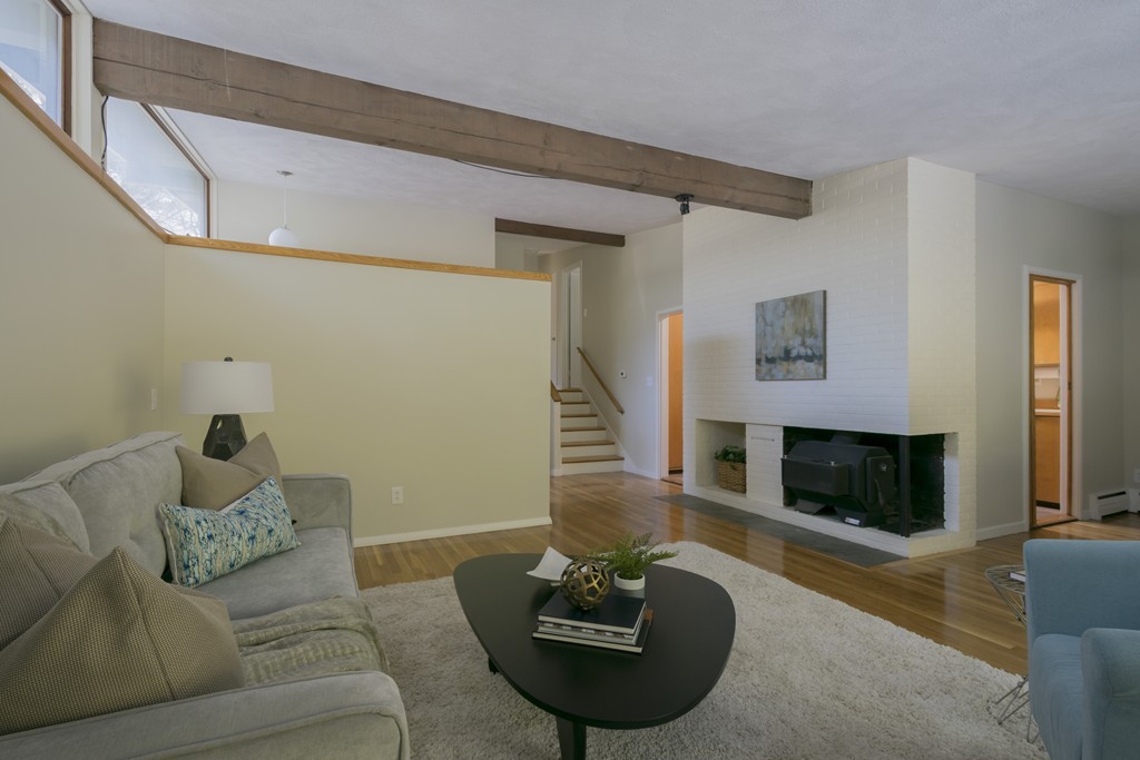 18 Peacock Farm Road Lexington, MA 02421 - Photo 6 of 30 a living room with furniture and a fireplace