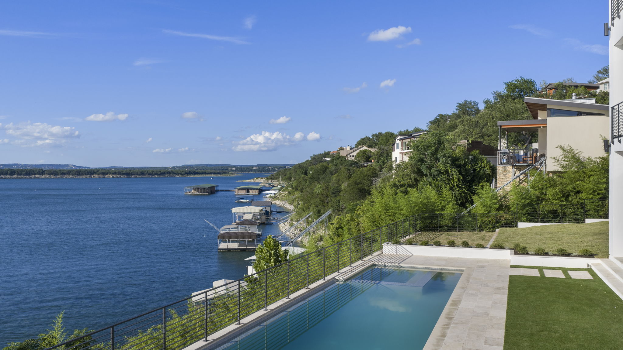 1496 Buffalo Gap Road Lakeway, TX 78734 - Photo 35 of 37 Experience lakeside living from this cliffside pool, overlooking expansive water views and private boat docks.