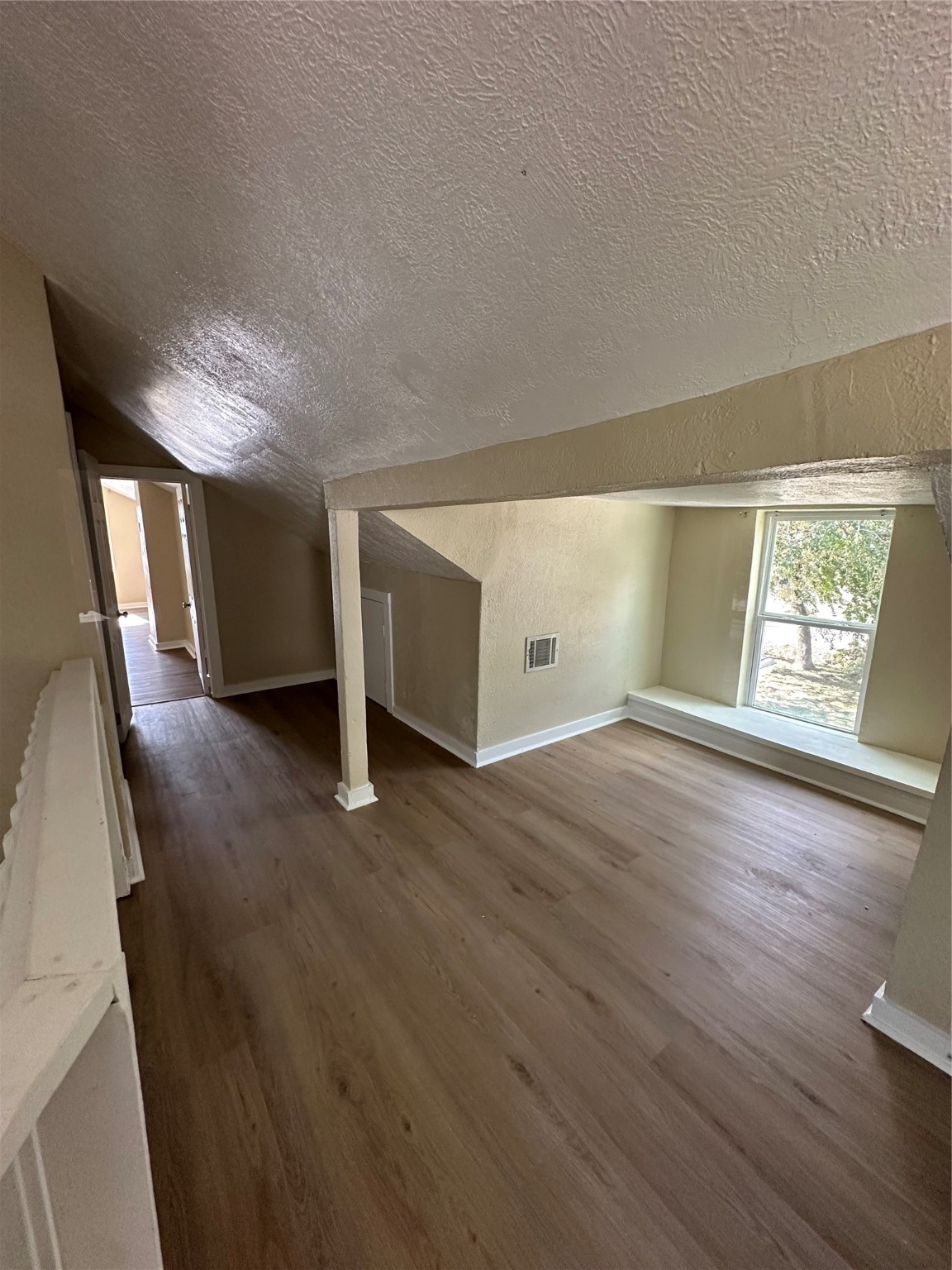 1411 Miles Street Houston, TX 77015 - Photo 13 of 14 a view of empty room with wooden floor and fan