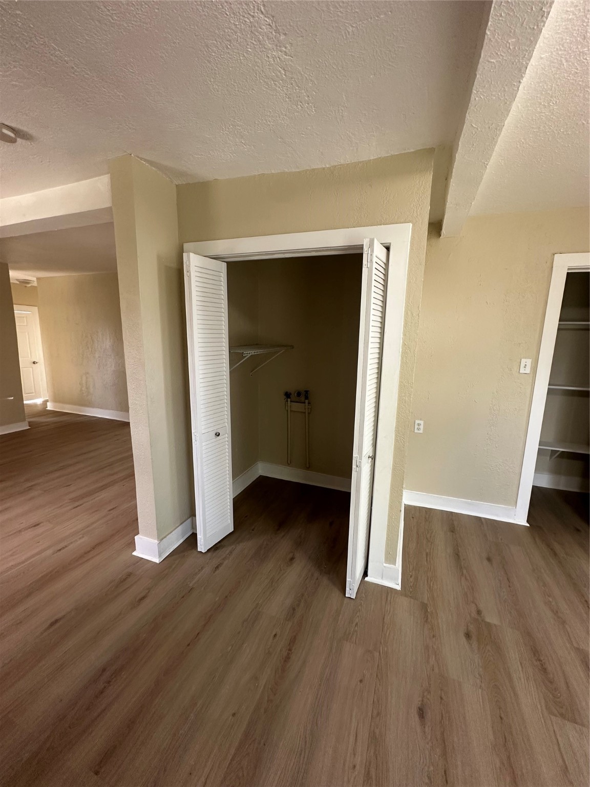 1411 Miles Street Houston, TX 77015 - Photo 4 of 14 an empty room with wooden floor and closet