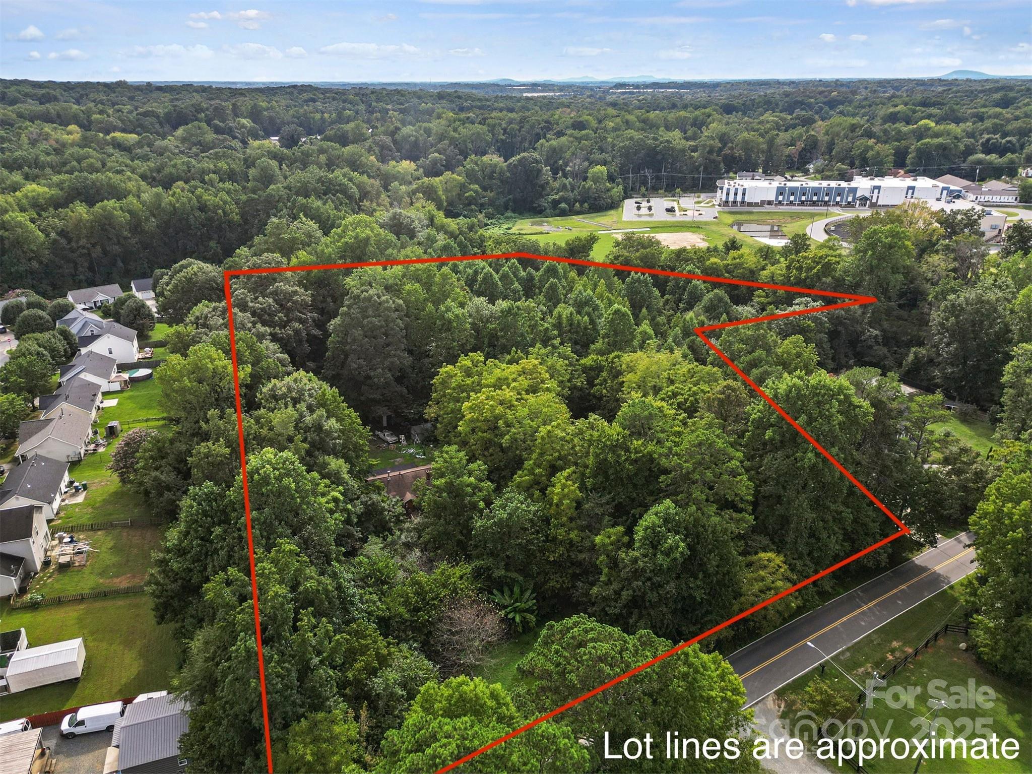 6109 Paw Creek Road Charlotte, NC 28214 - Photo 2 of 19 a view of a lake with a building in the background