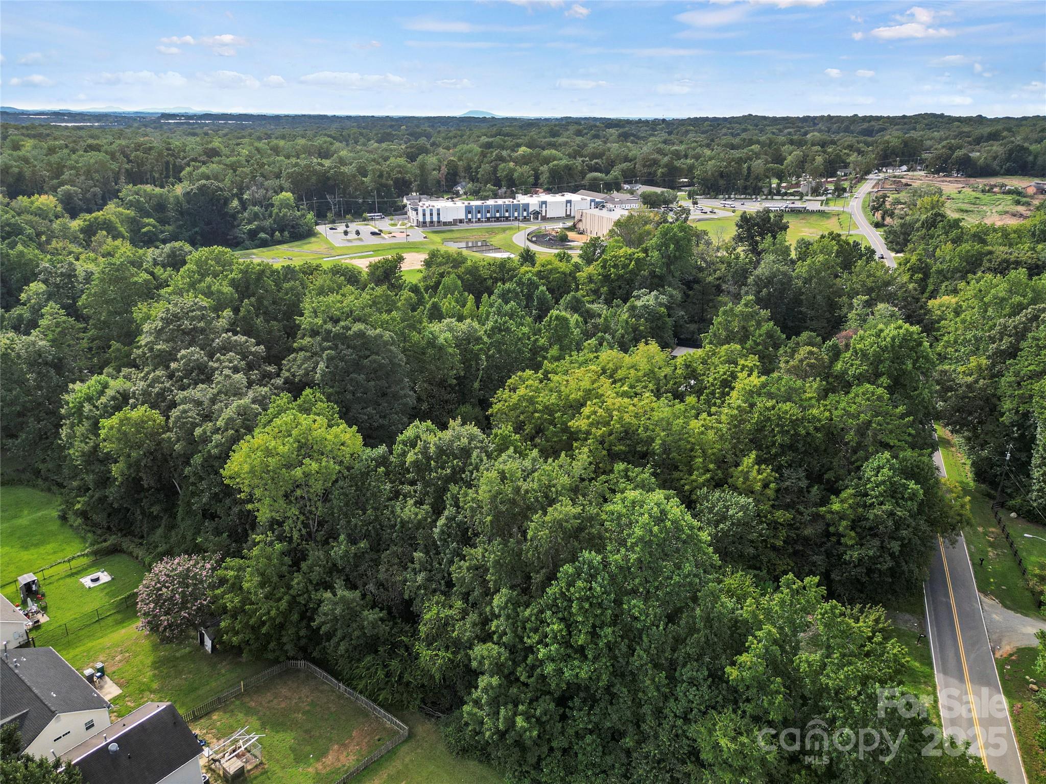6109 Paw Creek Road Charlotte, NC 28214 - Photo 8 of 19 an aerial view of residential houses with outdoor space and trees