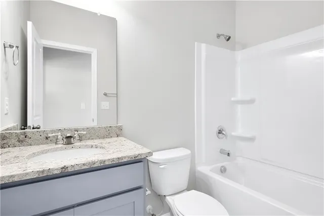 an empty room with a chandelier fan