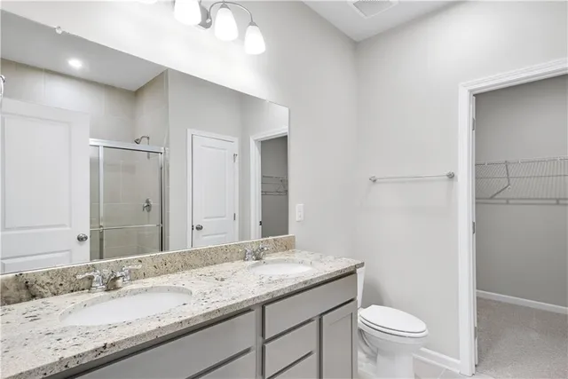 a bathroom with a glass shower door