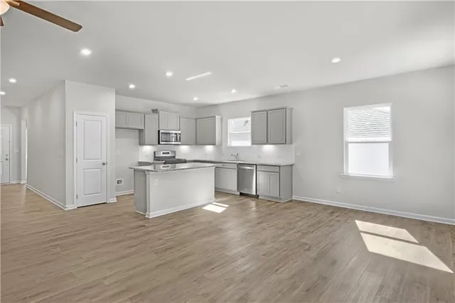 a view of kitchen with wooden floor