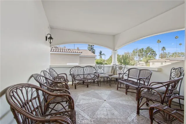 a view of a chairs and table in patio