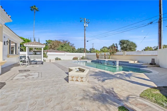 a view of a swimming pool with chairs