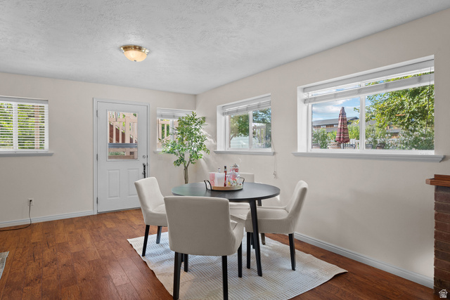 555 East 1700 N Street Mapleton, UT 84664 - Photo 35 of 49 Wood-finish flooring, multiple windows, white door with glass panel, recessed lighting, and a brick-finish architectural element