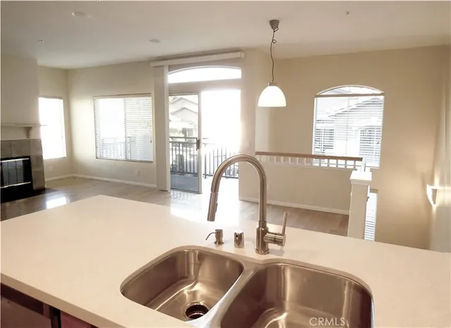 a kitchen with a refrigerator sink and microwave